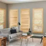 Norman wood blinds add warmth and natural elegance to a stylish room interior