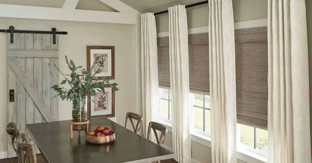 Home interior with curtains and woven shades